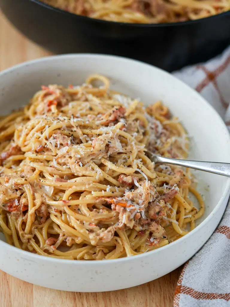 Close-up of Caramelised onion pasta served in a bowl, showcasing the texture and ingredients.