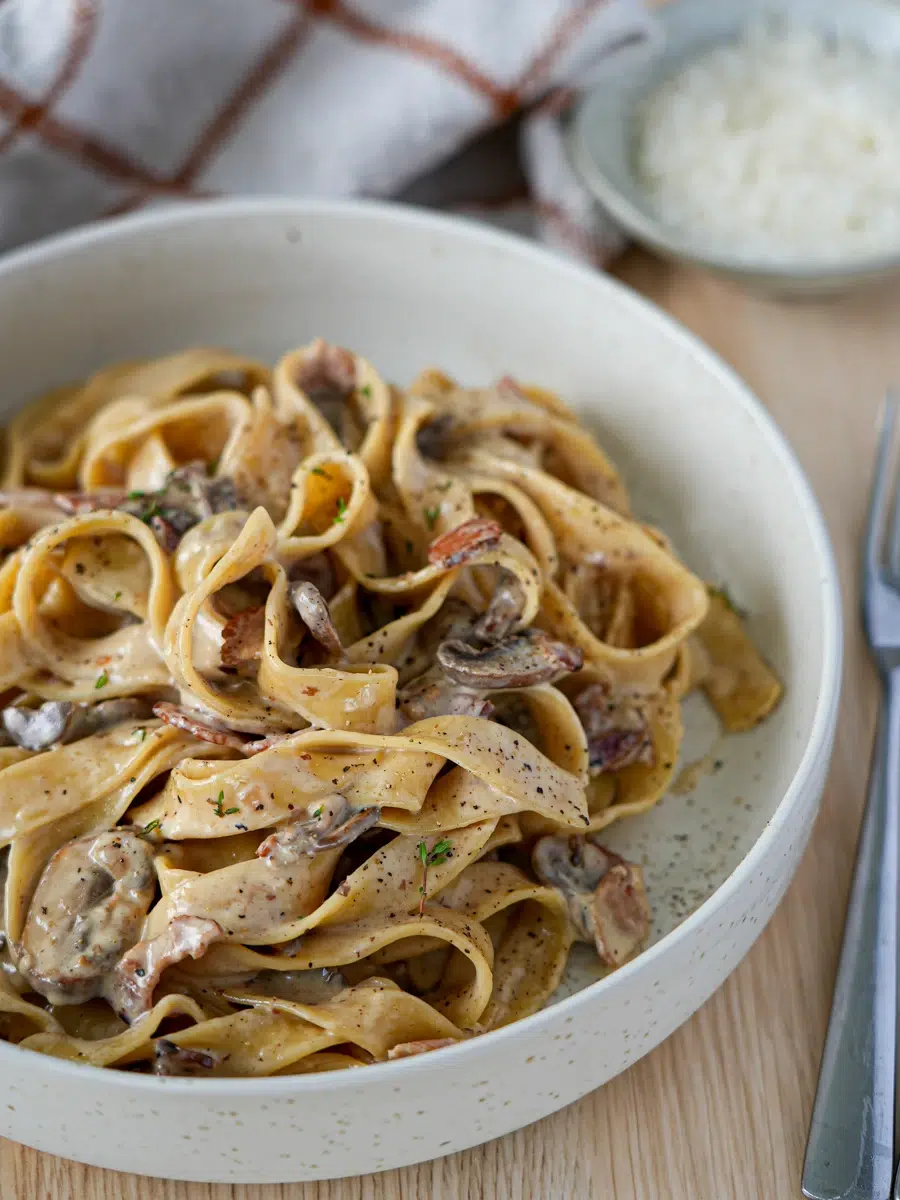 Creamy Mushroom and Bacon Pasta in deep bowl