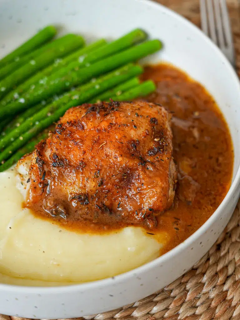 Close-up of one-pan Baked Chicken and Gravy in a plate